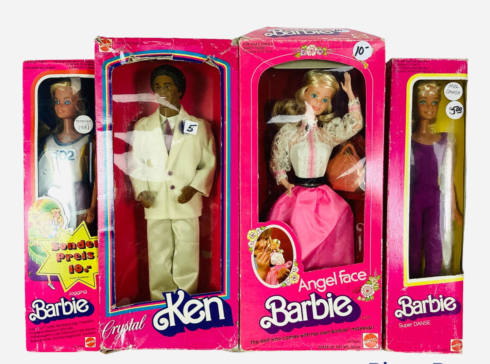 (4) Barbies & Ken In Pink Boxes. (1) Angel Face Barbie - Beautiful old fashioned dress with makeup,: (4) Barbies & Ken In Pink Boxes. (1) Angel Face Barbie - Beautiful old fashioned dress with makeup, etc. Barbie appears to be MINT but her box is damaged. (1) Crystal AA Ken wearing white tux & is min