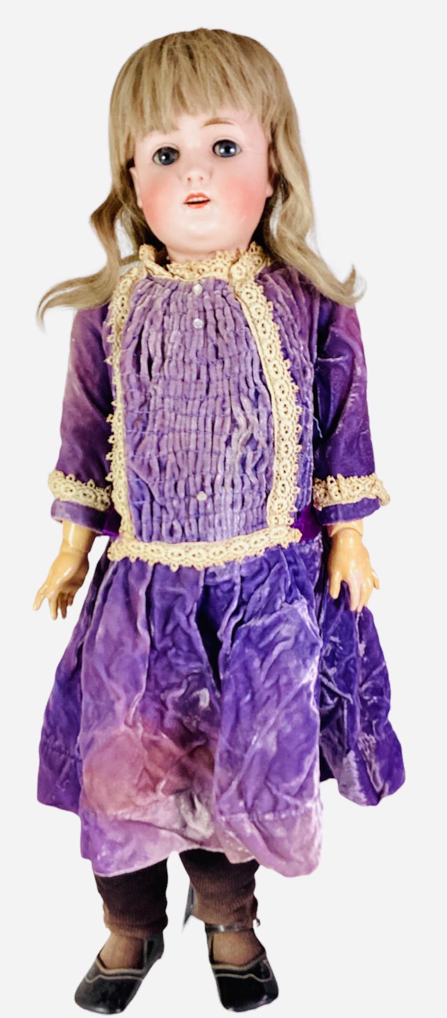 Kestner 168 bisque socket head girl. 27" doll with replaced human hair wig, glass sleep eyes with: Kestner 168 bisque socket head girl. 27" doll with replaced human hair wig, glass sleep eyes with eyelashes, open mouth with square cut teeth, on jointed composition body stamped "Germany 5 1/2" in re