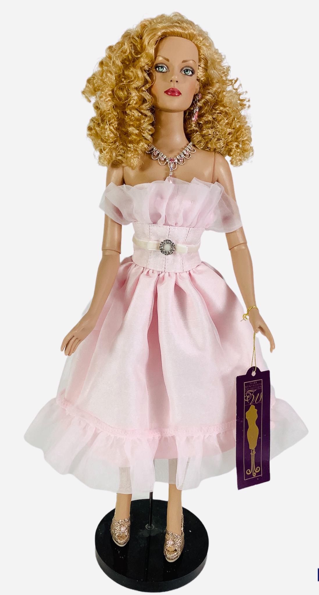 16" Tonner Tyler Wentworth Collection doll wearing a pink ruffle dress and pink shoes. Has hand tag. (1 of 2)