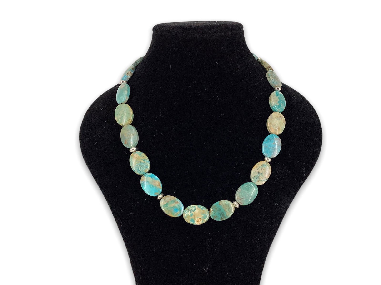 Semi-Precious Stone Necklace: Semi-Precious Stone Necklace Measuring 18”+ in length featuring polished oval shaped turquoise colored beds accented with silver tone beads (75% silver) and finishing with a sterling silver lobs