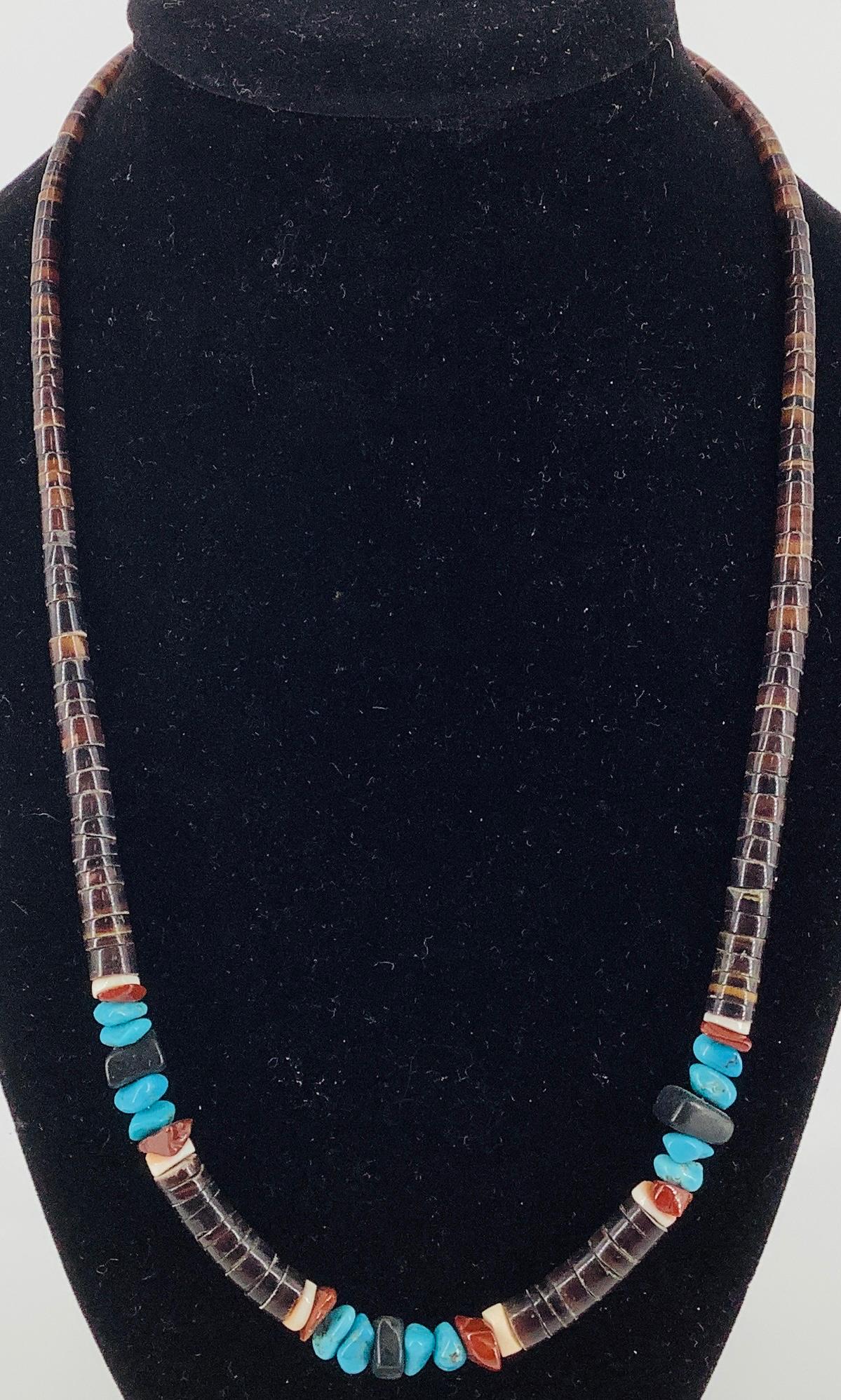 Southwestern Style Necklace: Southwestern Style Necklace Graduated design measuring 20” in length with shell, turquoise, jet & jasper beads finishing with a screw-back closure, unknown maker, unknown age.