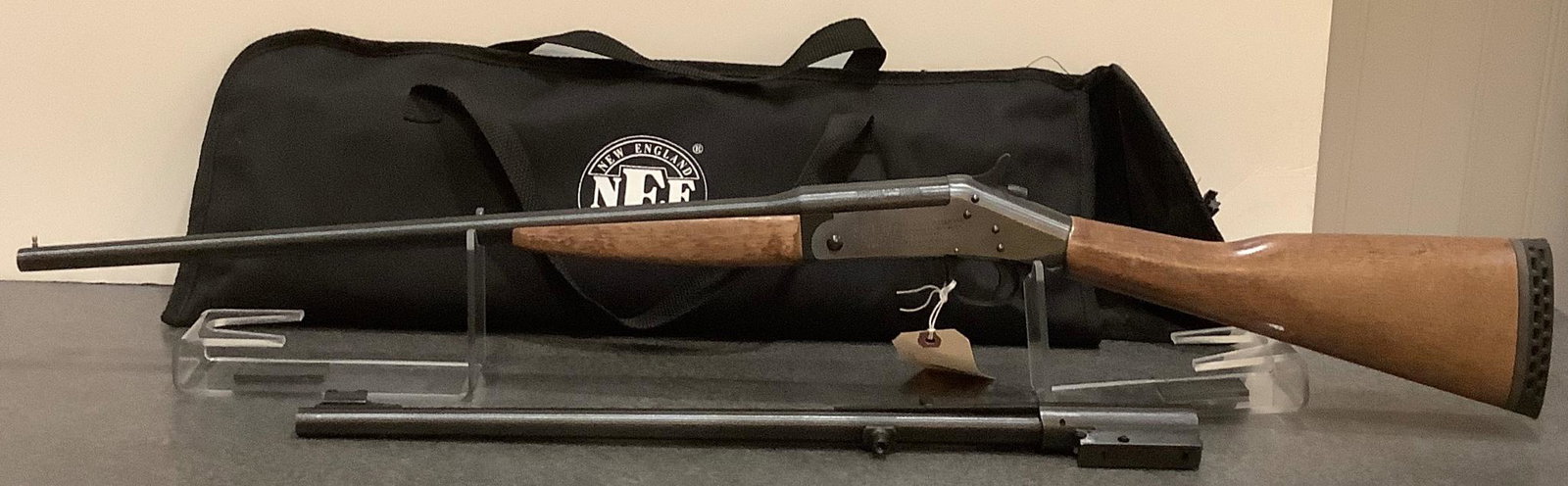New England Firearms Model Pardner/Versa-Pack .410 Gauge/.22 Caliber Shotgun/Rifle SN: NT301440,: New England Firearms Model Pardner/Versa-Pack .410 Gauge/.22 Caliber Shotgun/Rifle SN: NT301440, including soft case. By bidding on this lot buyer accepts responsibility of knowledge of State and Fede
