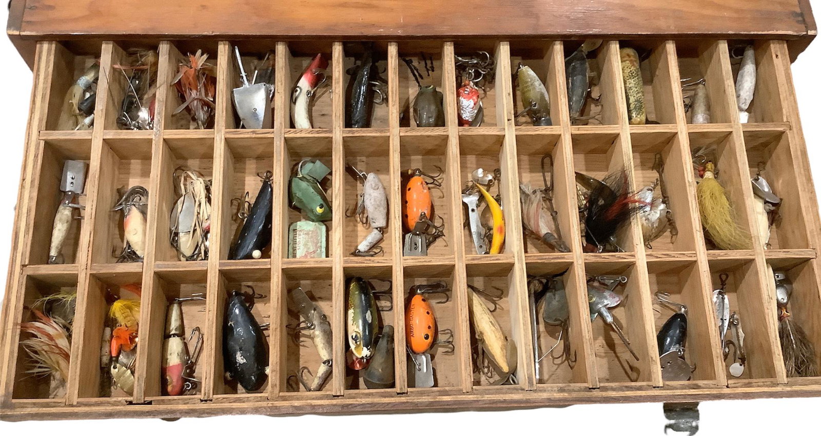 2 drawer wooden tackle box loaded with lures and fishing supplies. Box measures 22" x 11" x 6.5".: 2 drawer wooden tackle box loaded with lures and fishing supplies. Box measures 22" x 11" x 6.5".