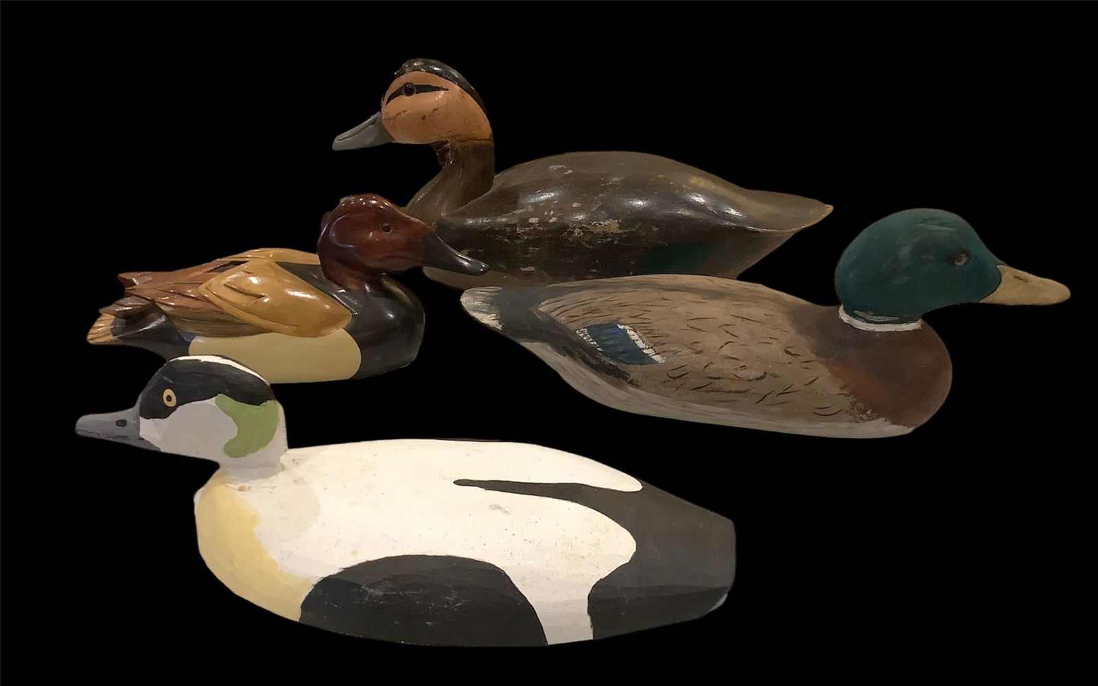 4 newer duck decoys including an eider, mallard drake and hen ( neck has been repaired) and: 4 newer duck decoys including an eider, mallard drake and hen ( neck has been repaired) and canvasback.