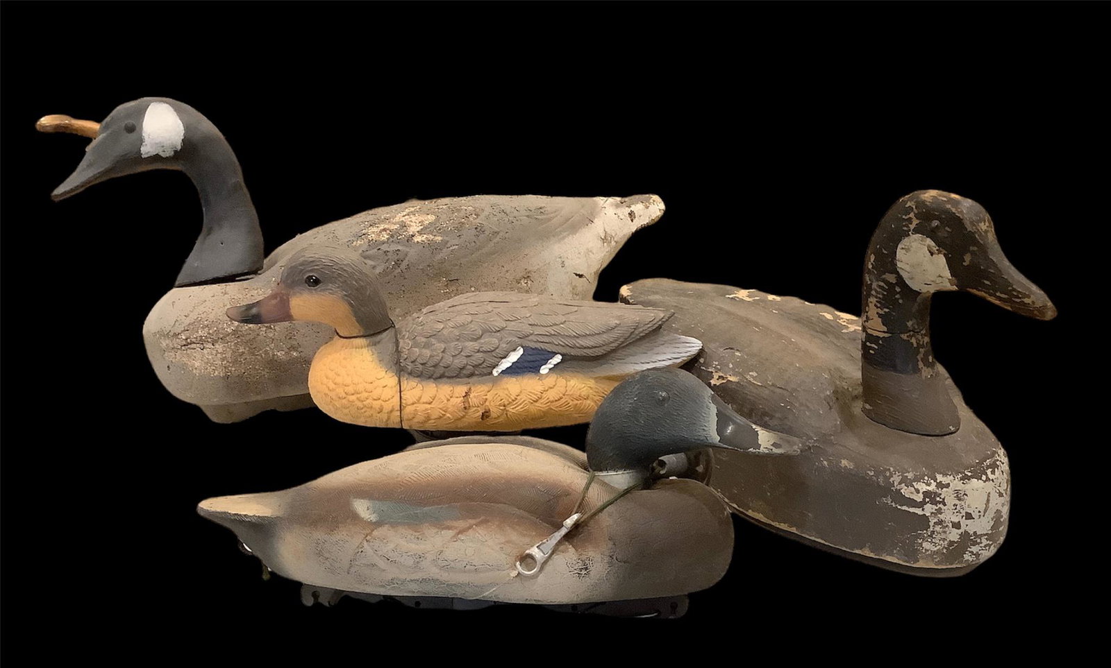 Lot of 4 working decoys - 2 Canada geese, one styrofoam and 1 wood and 1 pair of plastic mallards.: Lot of 4 working decoys - 2 Canada geese, one styrofoam and 1 wood and 1 pair of plastic mallards.