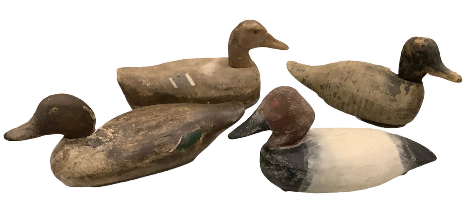 Lot of 4 wooden duck decoys including Mason pintail drake, canvasback drake, canvas covered decoy: Lot of 4 wooden duck decoys including Mason pintail drake, canvasback drake, canvas covered decoy and rough primitive.