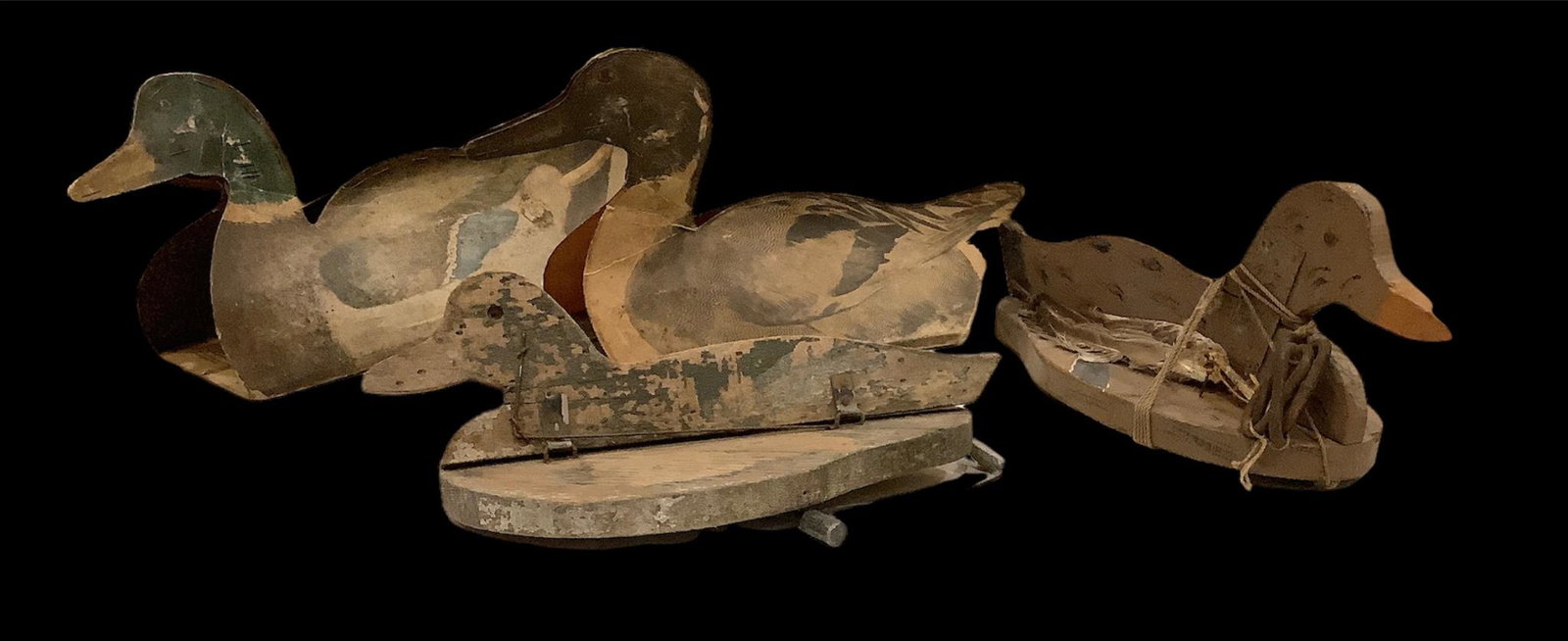 4 duck decoys - 2 paper field decoys and 2 flat wood, 1 with decomposing natural feather accents.: 4 duck decoys - 2 paper field decoys and 2 flat wood, 1 with decomposing natural feather accents.