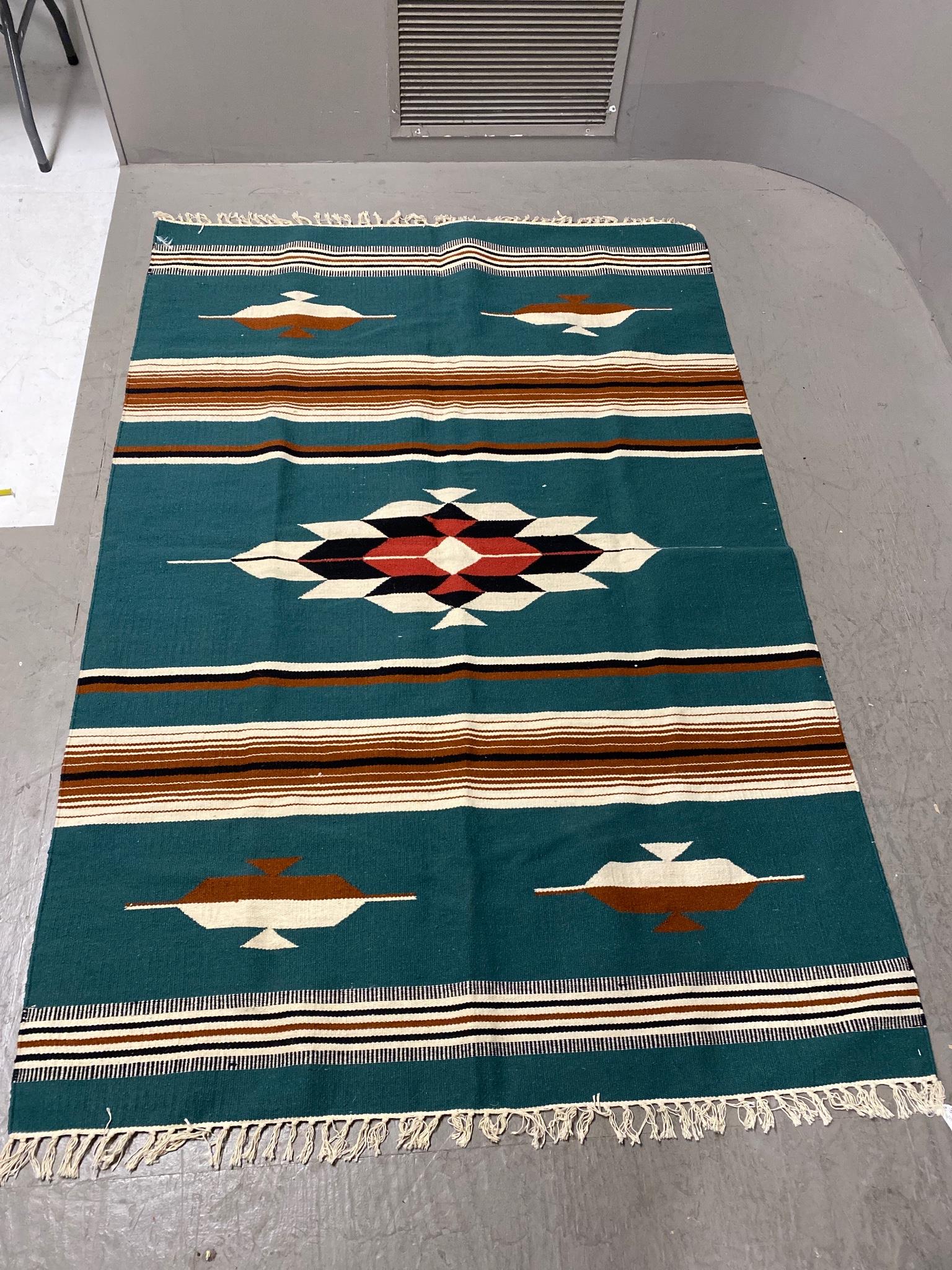 Rug with green brown and black accents 88" long and 59.5" wide: Rug with green brown and black accents 88" long and 59.5" wide