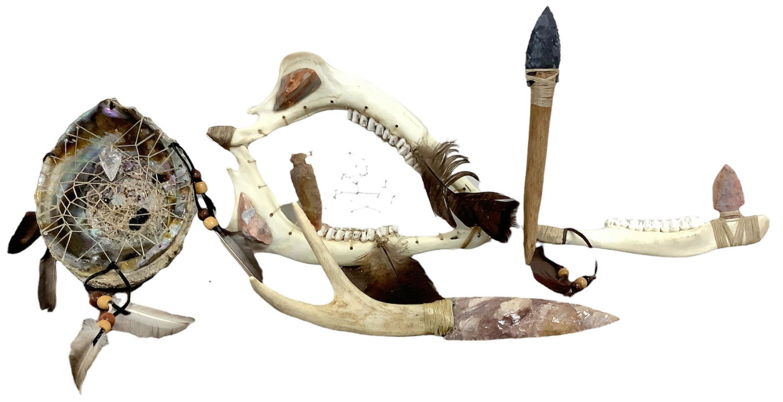 Lot including a dream catcher made from an abalone shell, a dream catcher made from an animals jaw: Lot including a dream catcher made from an abalone shell, a dream catcher made from an animals jaw bone, a dagger with wooden handle and flint blade, 9"L, a daggar with an antler handle and flint blad