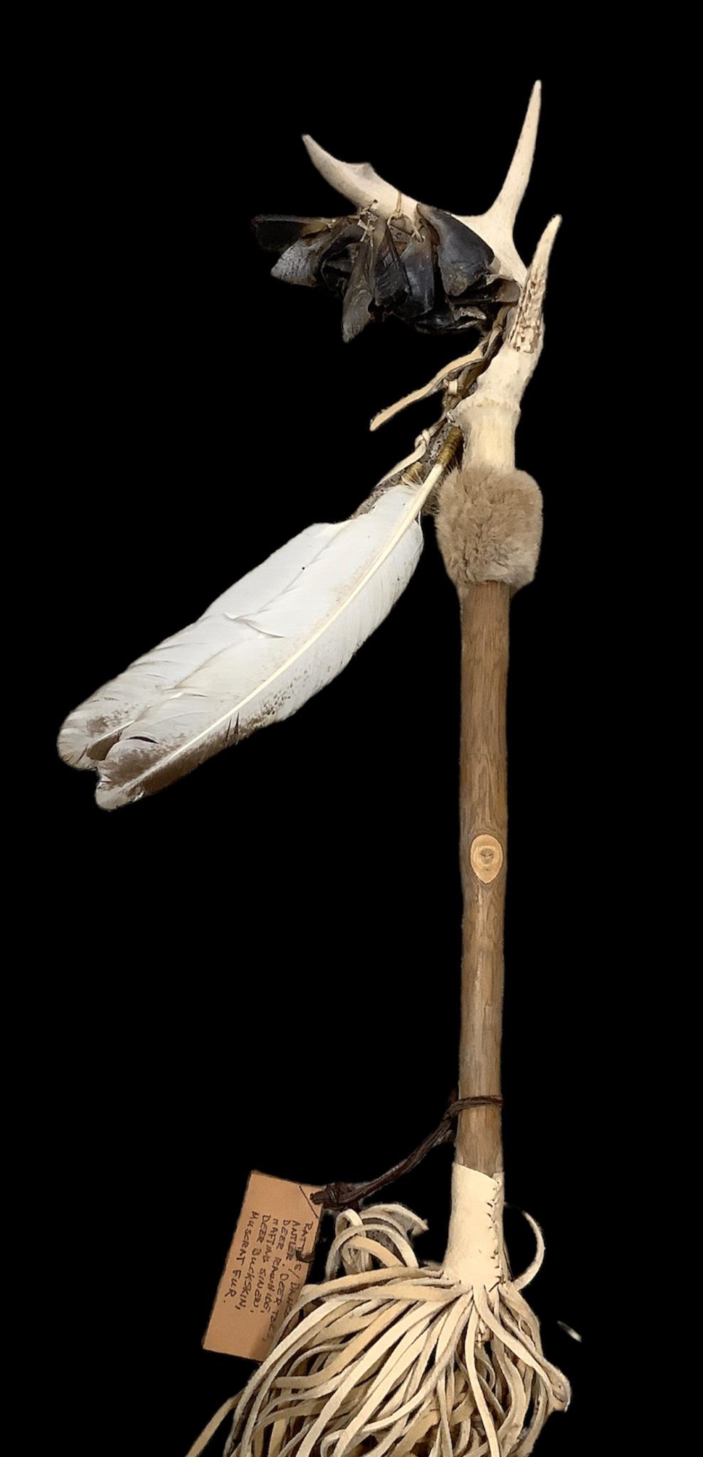 Native American deer hoof Dancing rattle reproduction. Made with deer antler and hooves with natural: Native American deer hoof Dancing rattle reproduction. Made with deer antler and hooves with natural fur accents. 23" long not including fringe.