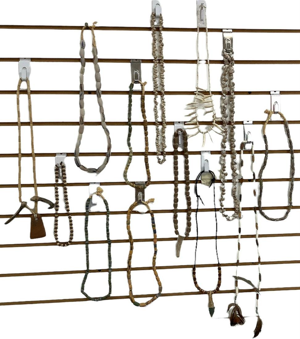 Lot of 13 Native American style necklaces, made of stringed beads and shells.: Lot of 13 Native American style necklaces, made of stringed beads and shells.