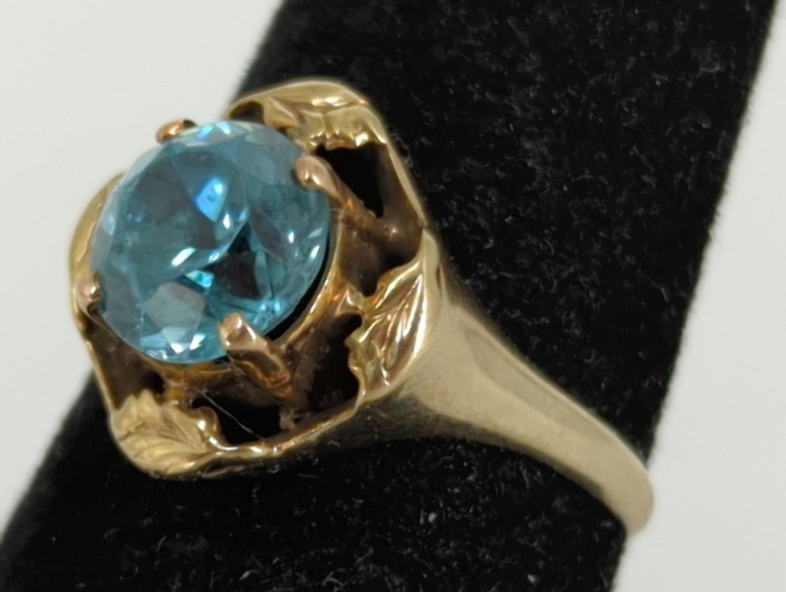 Vintage Gold and Topaz Ring: Vintage Gold and Topaz Ring 10kt yellow gold (stamped and tested), 2.8 grams total weight, size 5.75 tapered shank, unsigned, vintage age, prong set center stone (blue topaz), topaz approximately 1.72