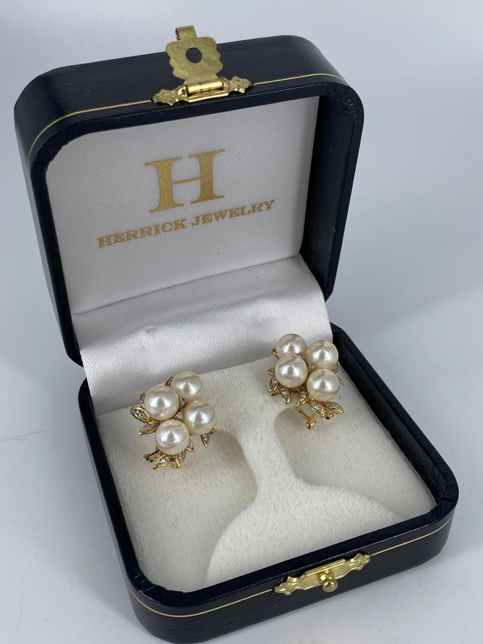 14kt Yellow Gold, Diamond & Pearl Earrings: 14kt Yellow Gold, Diamond & Pearl Earrings Omega back design measuring (22.9mm x 18.5mm) each containing four white pearl rounds with cream undertones, strong luster and minimal blemishes (approx. 7mm