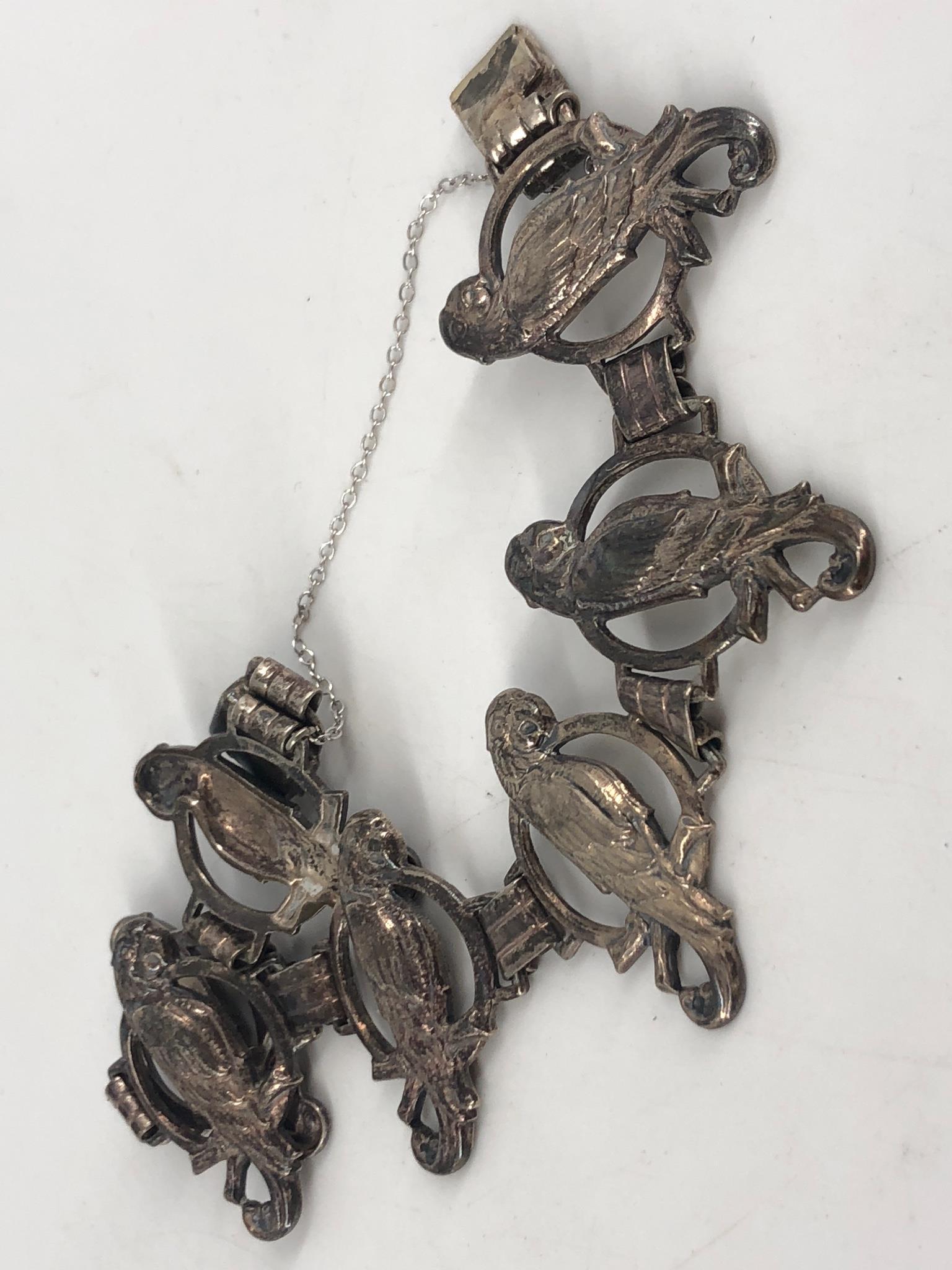Vintage Sterling Silver Bracelet: Vintage Sterling Silver Bracelet 7.25" in length, with attached safety chain, stamped and tested sterling silver, parrots motif, age related wear/tarnish, openwork links design (links measure 29.0mm i