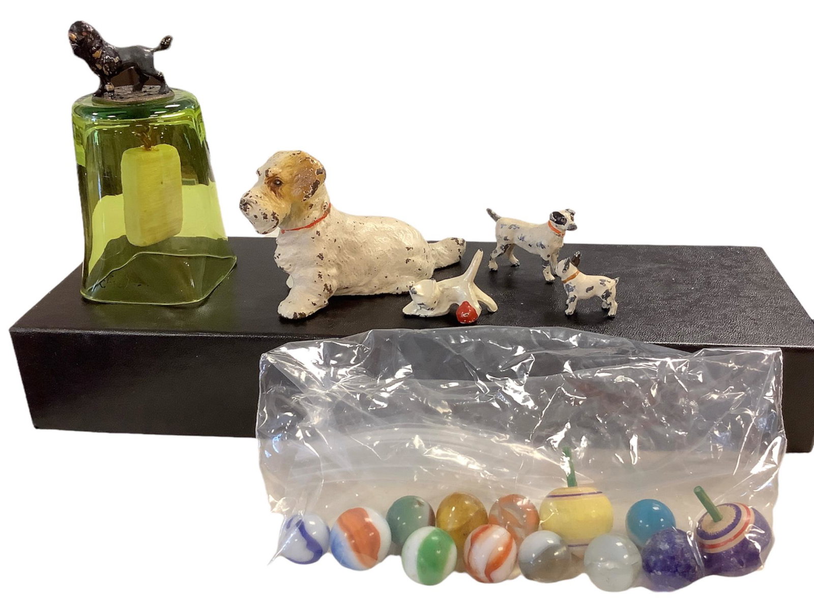Lot consisting of vintage marbles and spinning tops, canine themed green glass bell marked "France," (1 of 2)