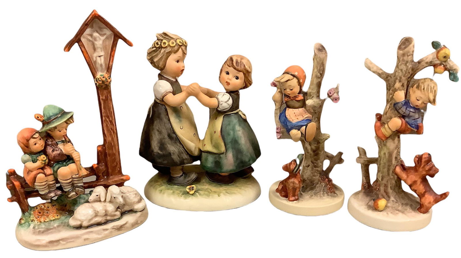 Four Hummel figurines including Wayside Devotion, Spring Dance, Culprits and Out Of Danger, range I (1 of 2)