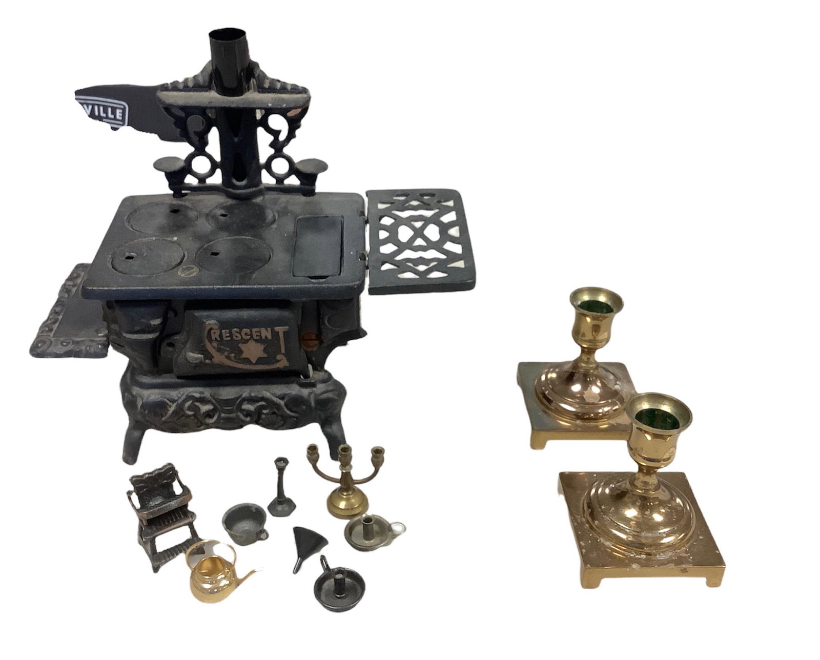 Crescent Cast iron stove salesman sample with some metal toys and two brass candlesticks holder. (1 of 1)