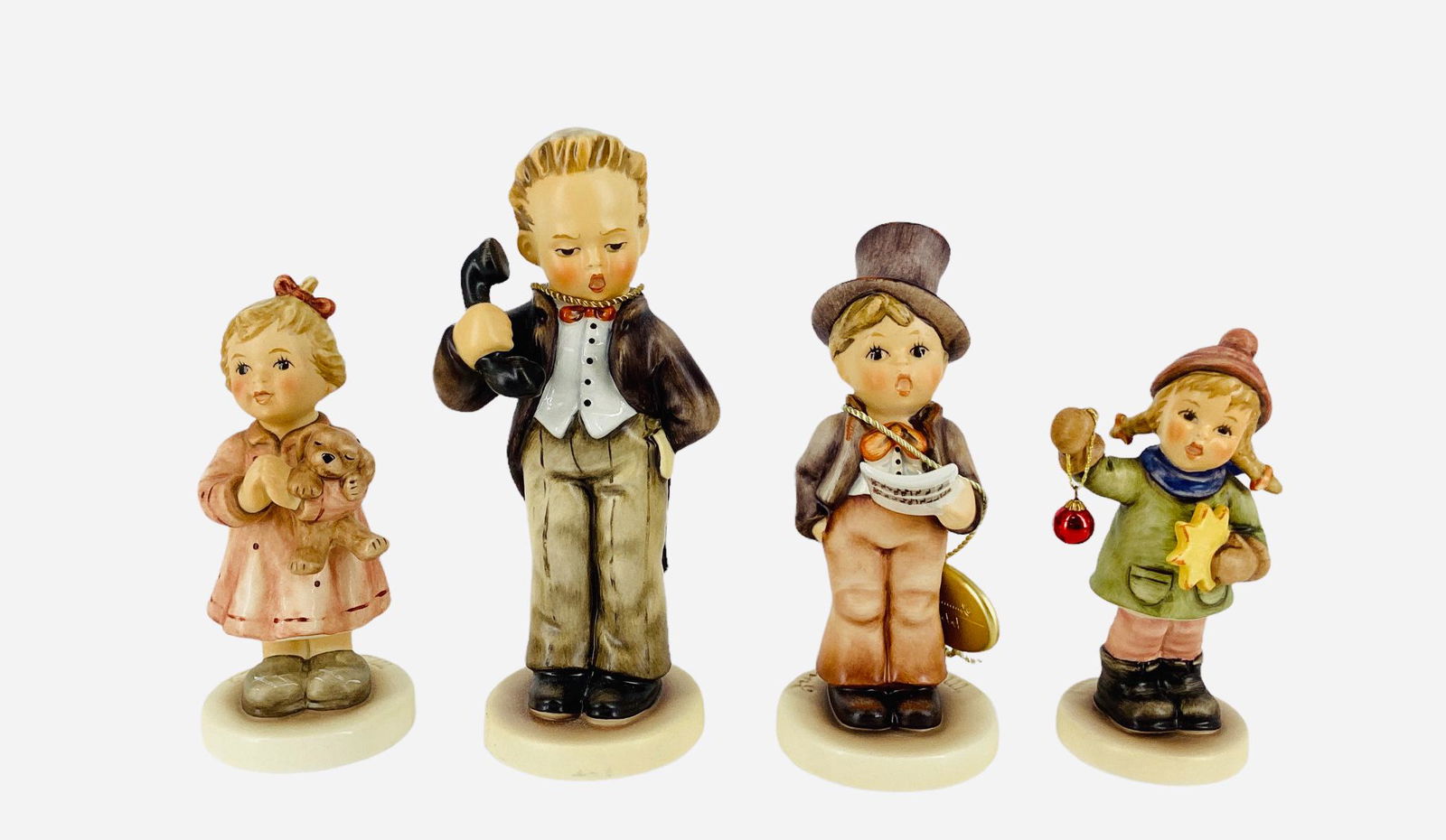 4 H.J. Hummel Goebel figurines Holiday 4.25" with box, Street Singer 5 1/8" with box, A Prayer for (1 of 2)