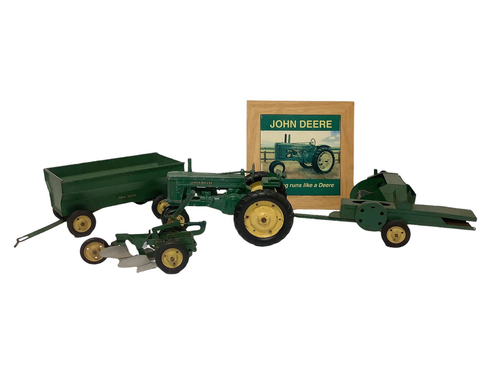 Lot of vintage John Deere metal toys and a John Deere sign, 8" x 8". (1 of 1)