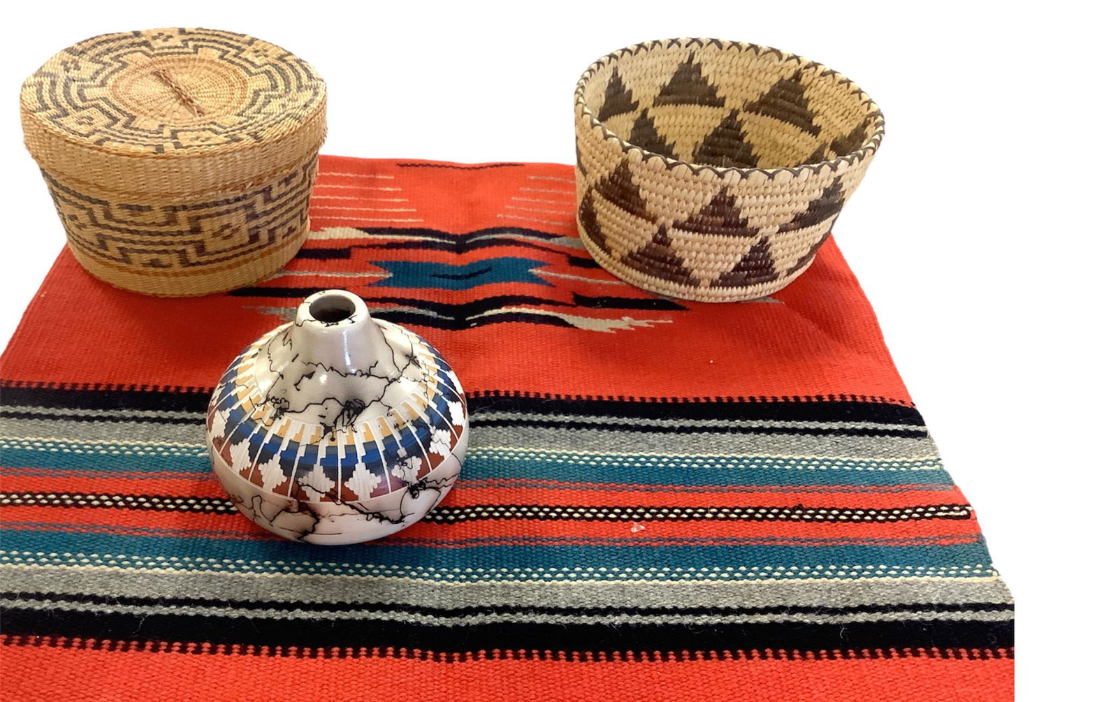 Navajo print 19"x 40" rug. Navajo horse hair pot signed.Two woven baskets. (1 of 1)