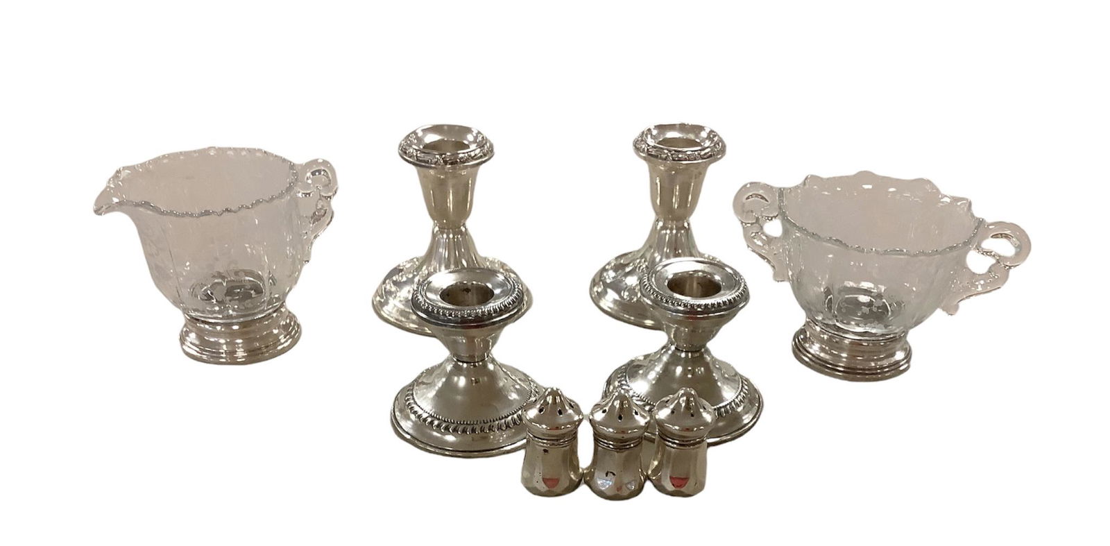 Vintage sterling cream and sugar glass with four weighted Sterling candle stick holders and three (1 of 1)