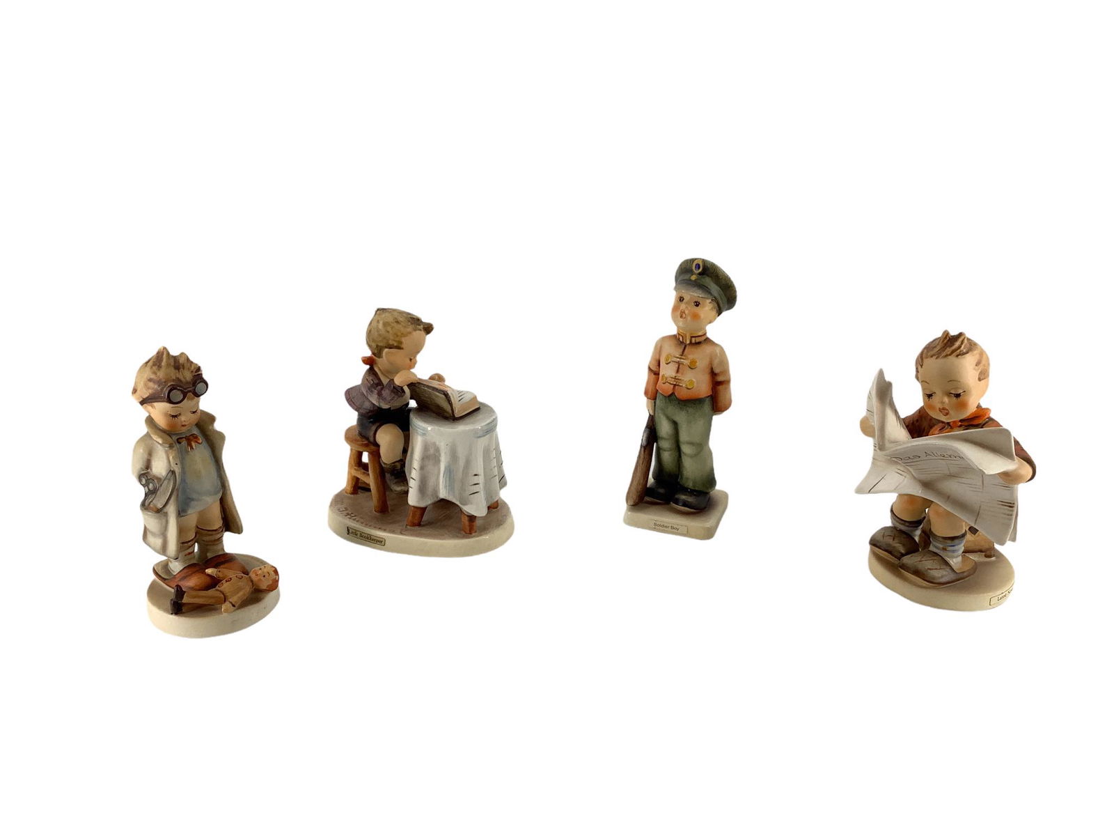 Lot of 4 Hummel figures which include "Doll Doctor ", "Soldier Boy", "Little Bookkeeper ", and (1 of 3)