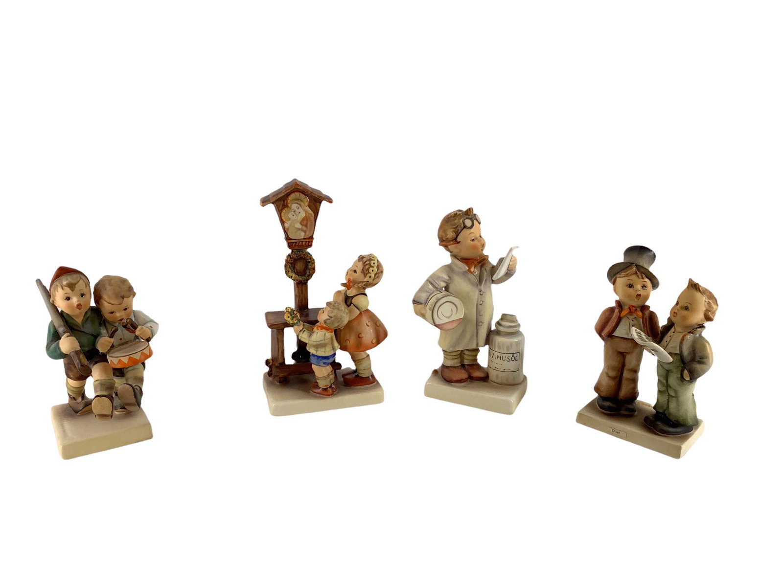 Lot of 4 Hummel figures which include "Volunteers", "Adoration ", "Duet", and "Little Pharmacist ".: Lot of 4 Hummel figures which include "Volunteers", "Adoration ", "Duet", and "Little Pharmacist ". All range 4.5 - 6" tall.