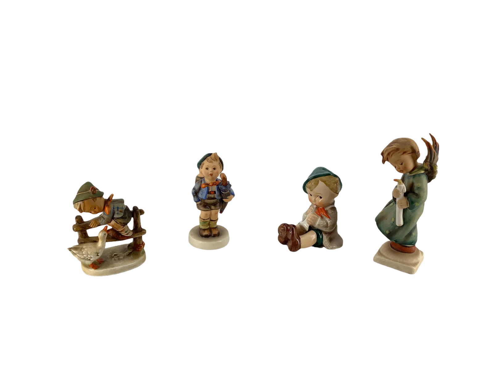 Lot of 4 Hummel figures which include "Barnyard Hero", "Home from Market", "Pretzel Boy pretzel (1 of 3)