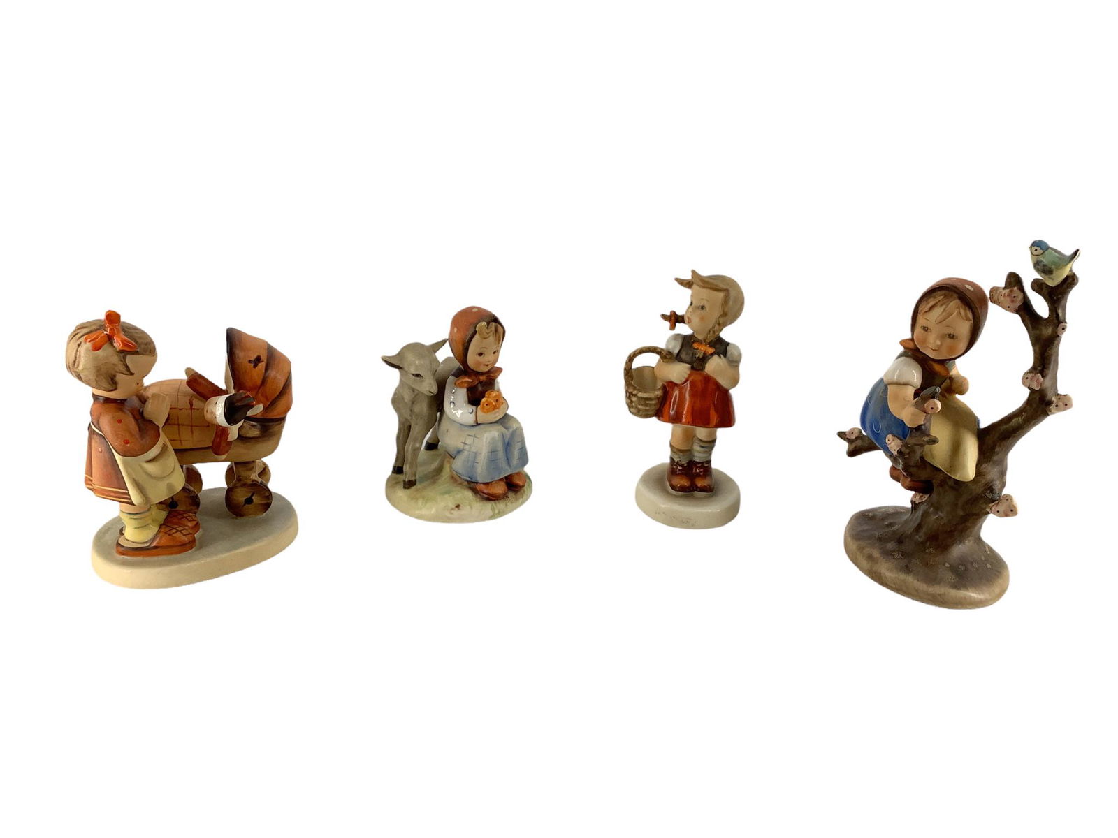 Lot of 4 Hummel figures which include "Appletree Girl", "Girl with Basket", "Doll Mother", and "Good (1 of 3)