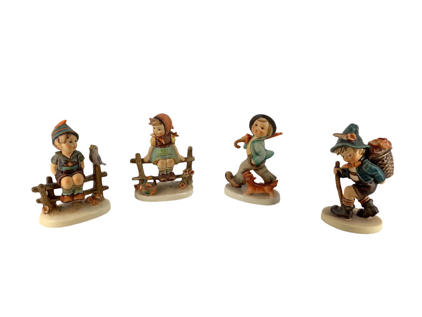 Lot of 4 Hummel figures which include "Just Resting", "Flower Vendor", "Strolling Along ", and (1 of 3)