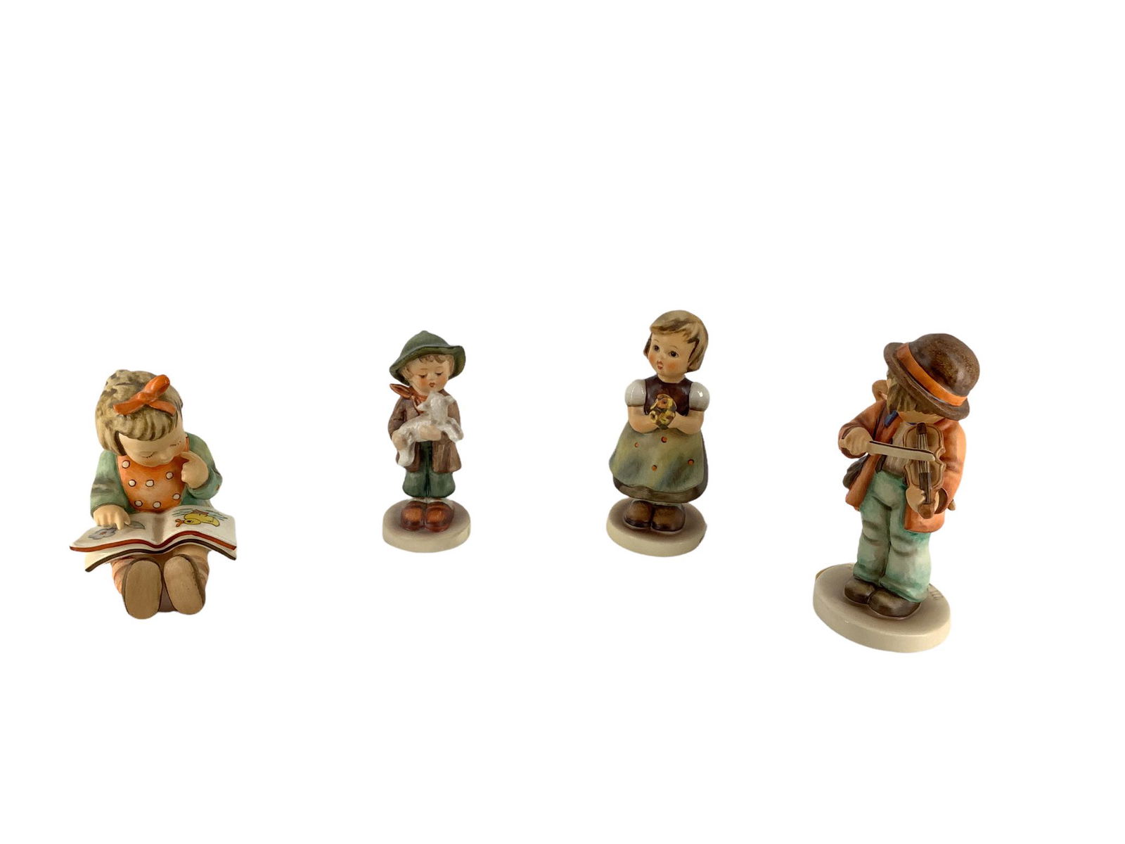 Lot of 4 Hummel figures which include "Bookworm ", "Little Fiddler", "For Mother ", and "Lost Sheep (1 of 3)