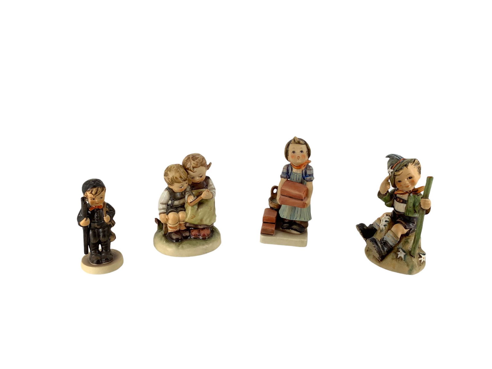 Lot of 4 Hummel figures which include "Chimney Sweep", "Mountaineer", "The Builder", and "Smart (1 of 3)