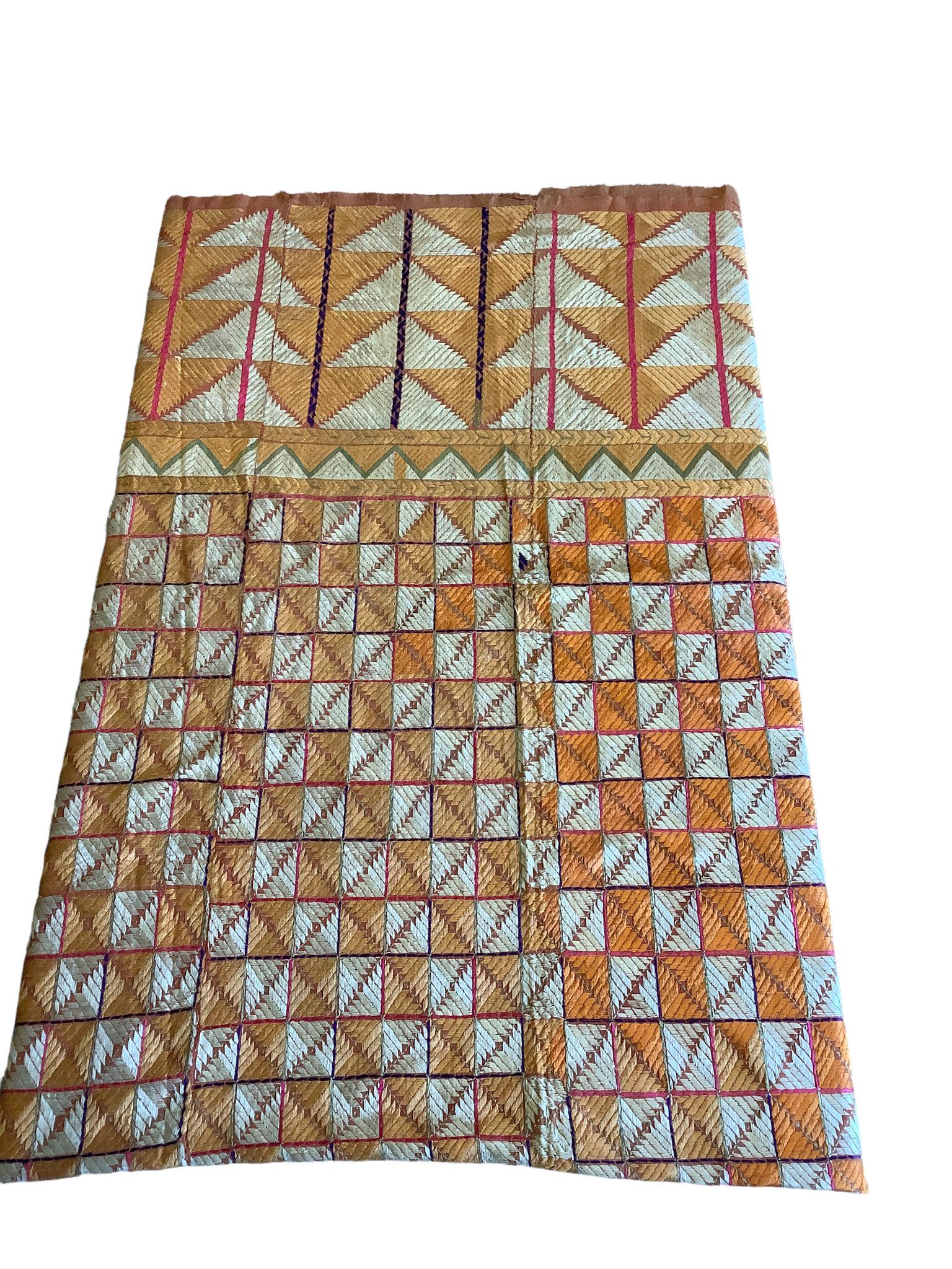 Four pieces of vintage embroidered fabric (possibly silk) that have been sewn together for a total: Four pieces of vintage embroidered fabric (possibly silk) that have been sewn together for a total size of 51" x 95", some spots and tears.