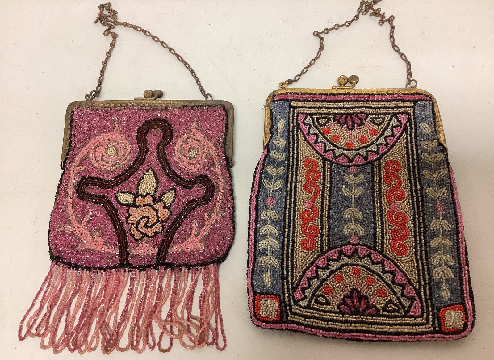 Lot of 2 vintage beaded bags in pinks and reds. Both bags have linings which are worn, chains have (1 of 2)
