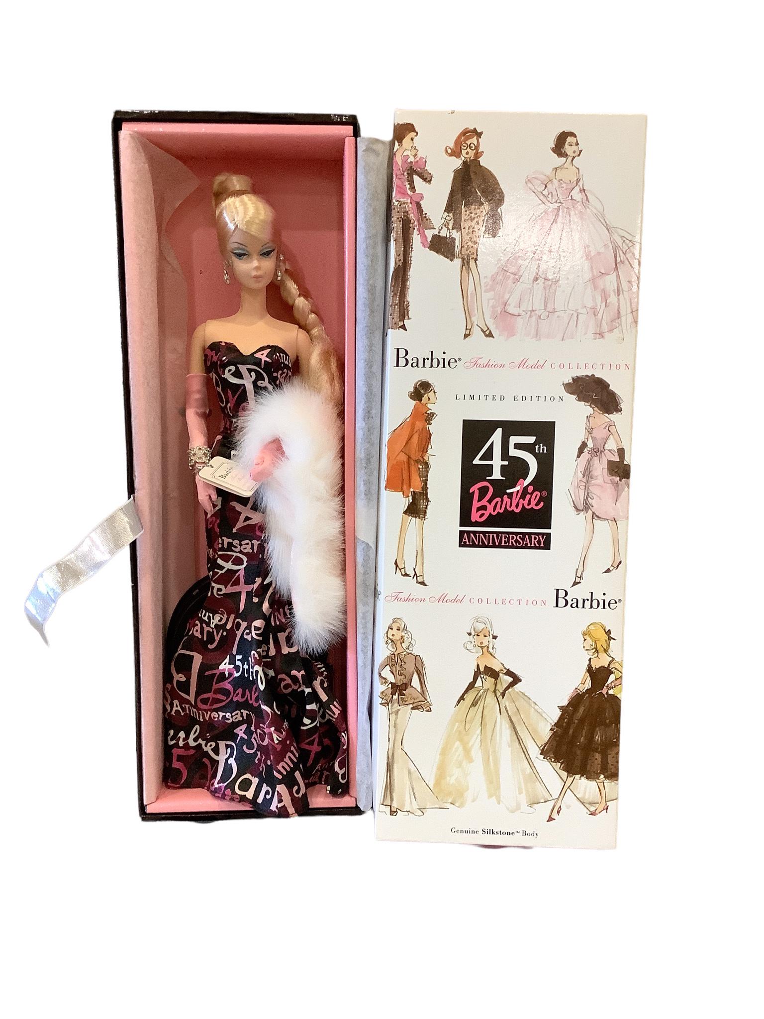 (1) Barbie that is a part of the Barbie Fashion Model Collection with Silkstone body. This is the: (1) Barbie that is a part of the Barbie Fashion Model Collection with Silkstone body. This is the 45th Barbie anniversary & has a gorgeous gown and also a faux fur, pink gloves, black shoes and gorgeo