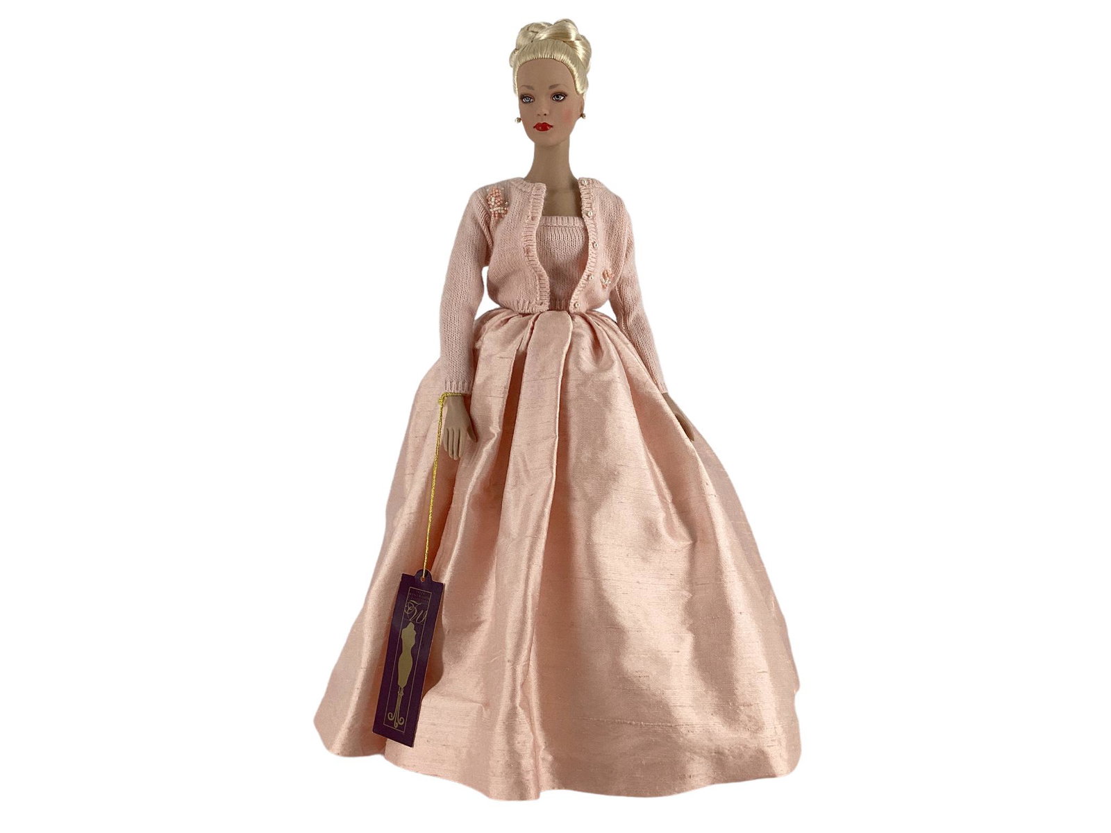 Blonde 16â€ Robert Tonner doll wearing tagged â€œPremiere Pinkâ€ taffeta skirt with white tulle: Blonde 16” Robert Tonner doll wearing tagged â€œPremiere Pink” taffeta skirt with white tulle underneath, cotton pink tube top with matching sweater trimmed in beads, nude hose, pink s