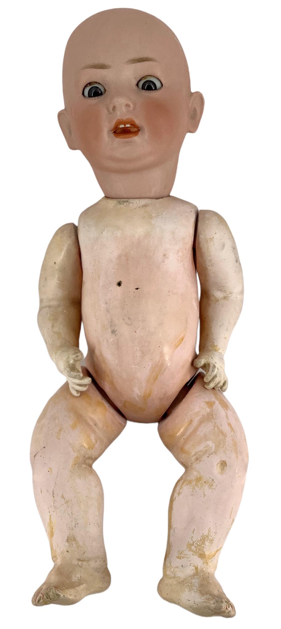 Revalo bisque socket head character baby. 16" doll with glass sleep eyes, open mouth with two molded: Revalo bisque socket head character baby. 16" doll with glass sleep eyes, open mouth with two molded upper teeth, on five-piece composition bent limb baby body. Bisque has no apparent damage, body has