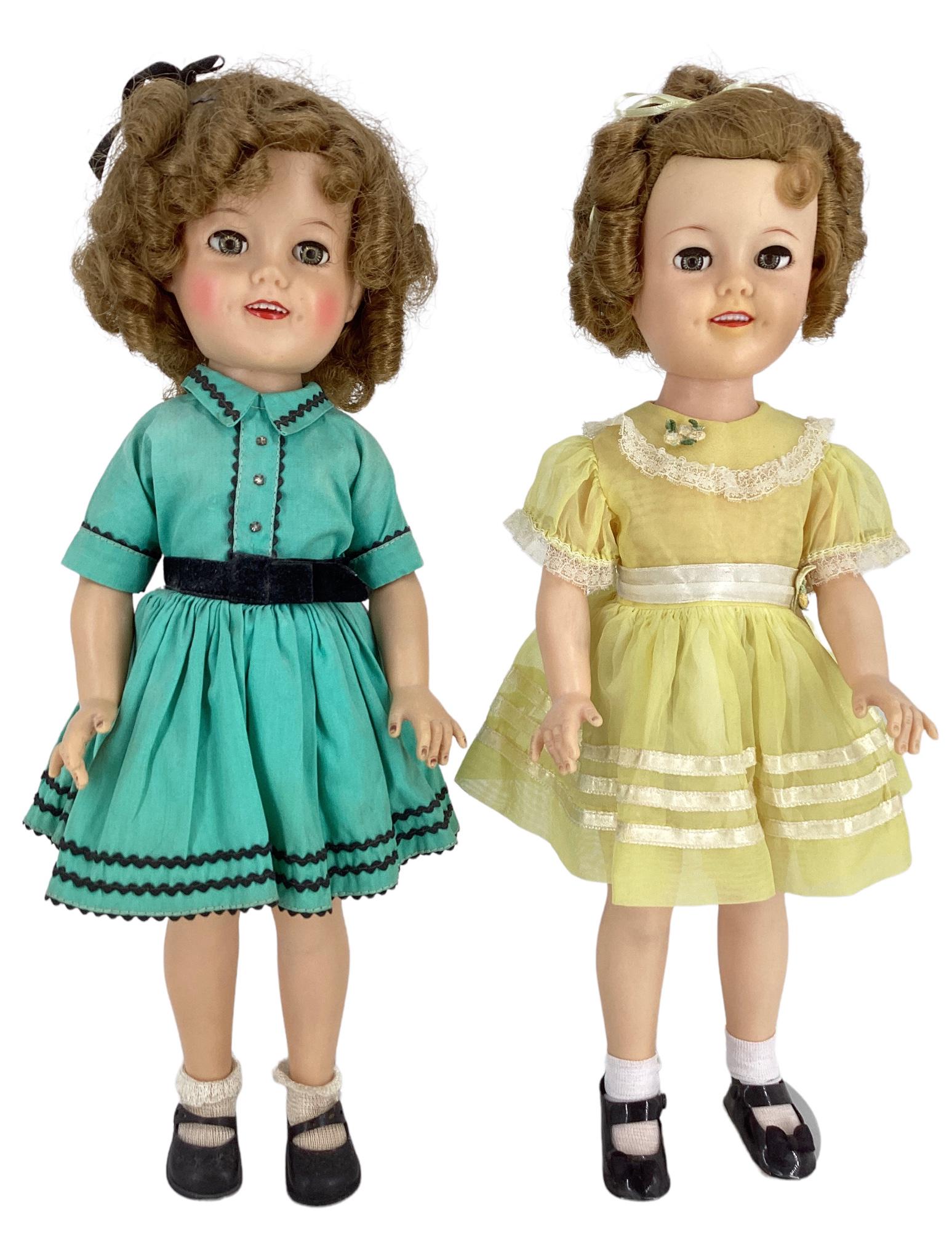 Pair of Ideal 17" Shirley Temple dolls, rooted mohair wig, molded eyelashes, glass sleep eyes (one: Pair of Ideal 17" Shirley Temple dolls, rooted mohair wig, molded eyelashes, glass sleep eyes (one in yellow has flirty, open mouth with teeth and painted facial features. One is wearing a yellow orga