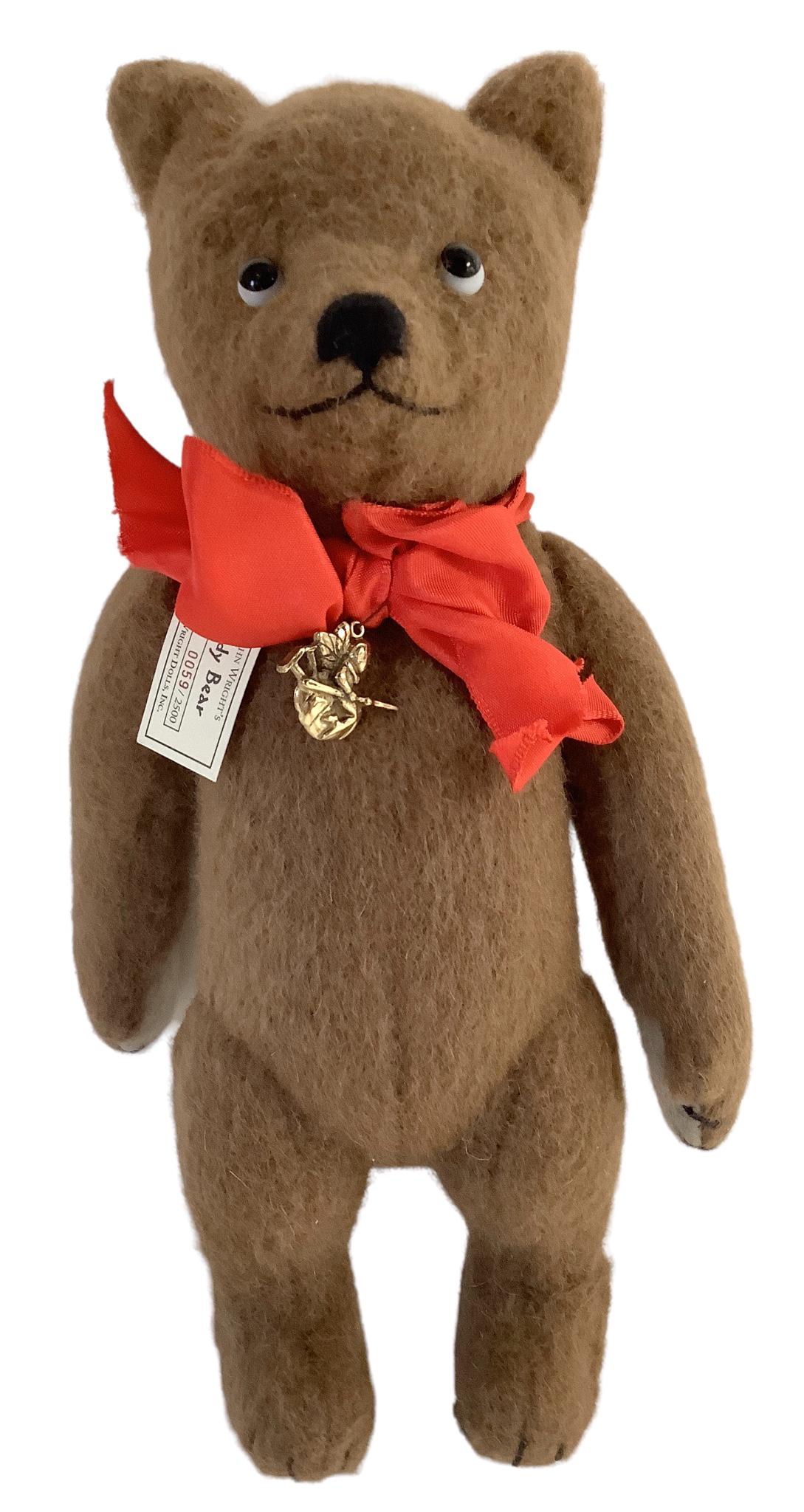 9" R. John Wright Collector Club Sitting Teddy Bear 59/2500, stuffed brown wool, sewn nose, mouth: 9" R. John Wright Collector Club Sitting Teddy Bear 59/2500, stuffed brown wool, sewn nose, mouth and paws, wearing a red satin ribbon with a gold charm and comes with original box & COA.