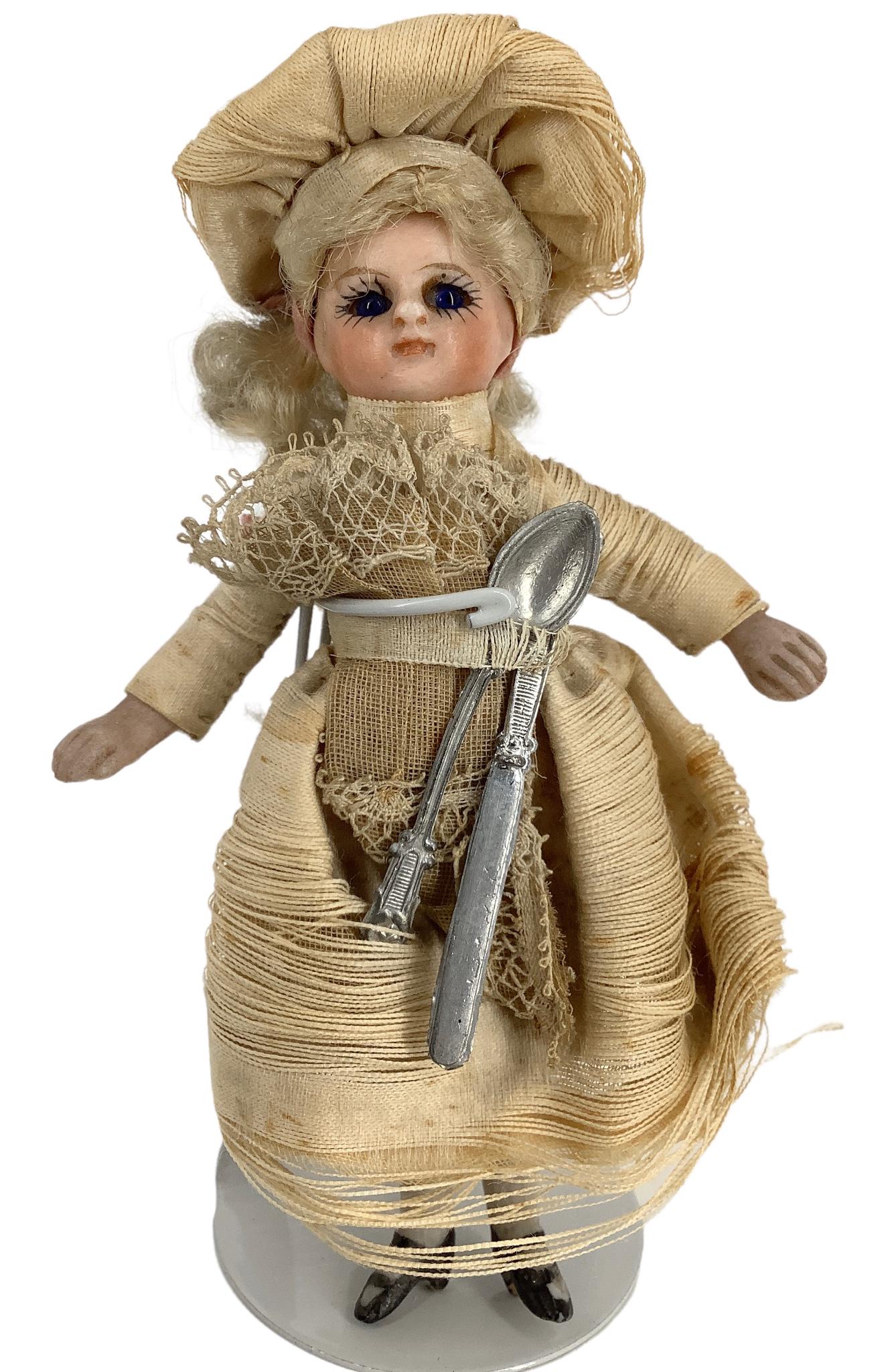 All-Bisque Mignonnette. 4" doll with mohair wig, stationary cobalt glass eyes with painted lashes, (1 of 4)