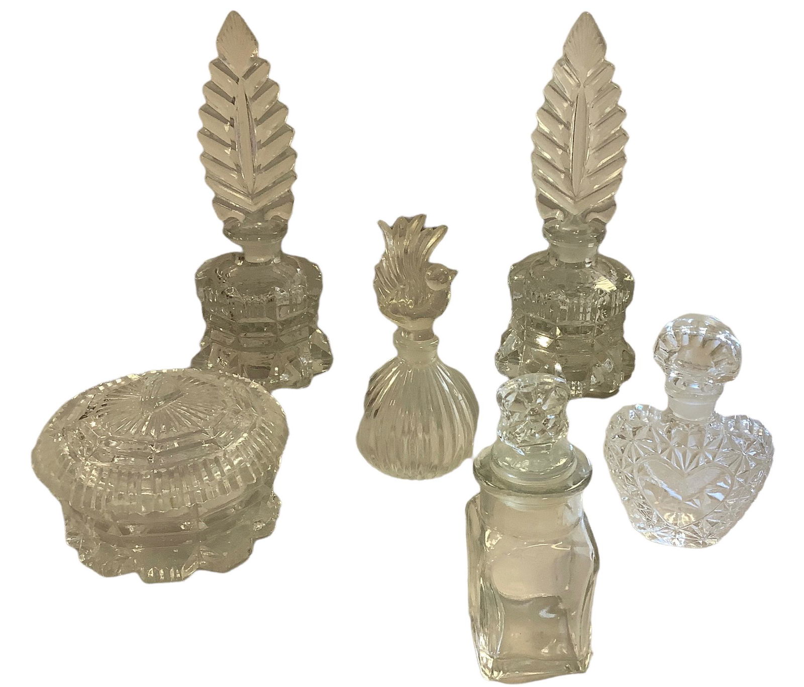 Lot of 6. Five perfume bottles with stopper tops and one variety box. All are clear glass. Range in (1 of 1)