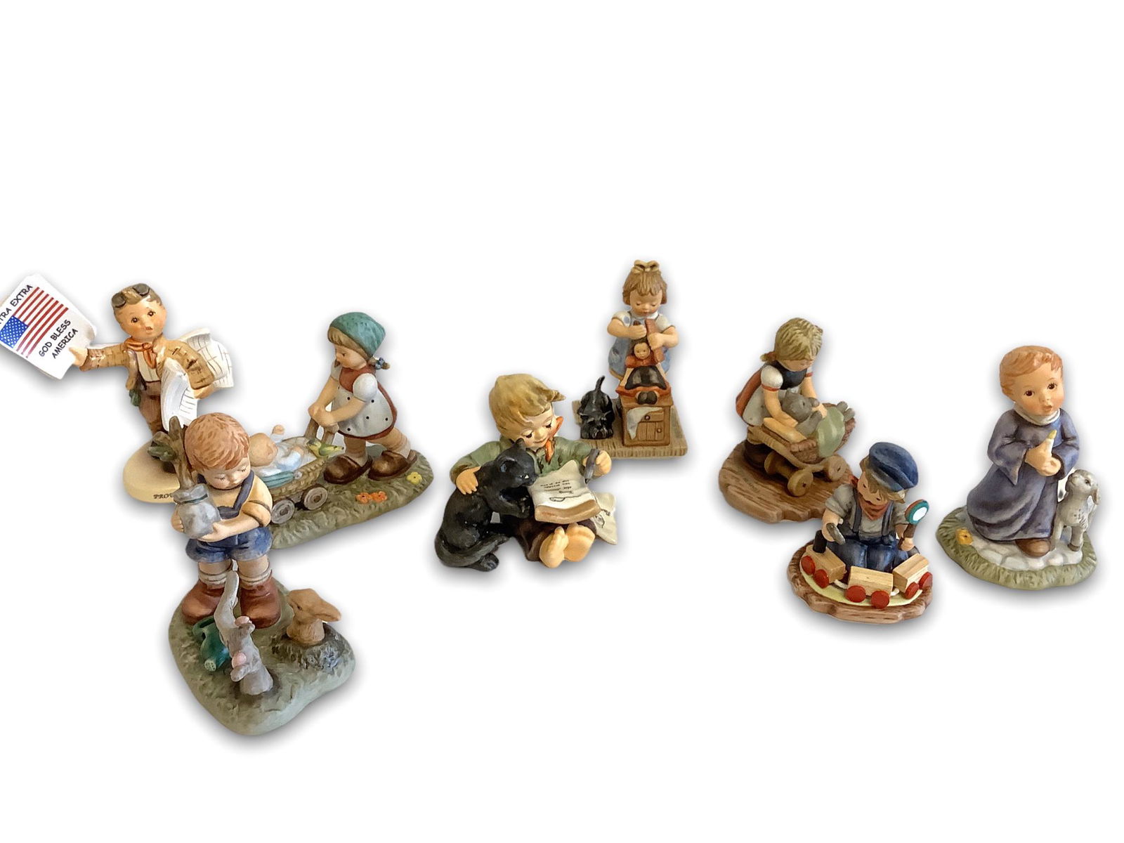 Lot of 8 Hummel figurines ranging 3" to 5" high (1 of 2)