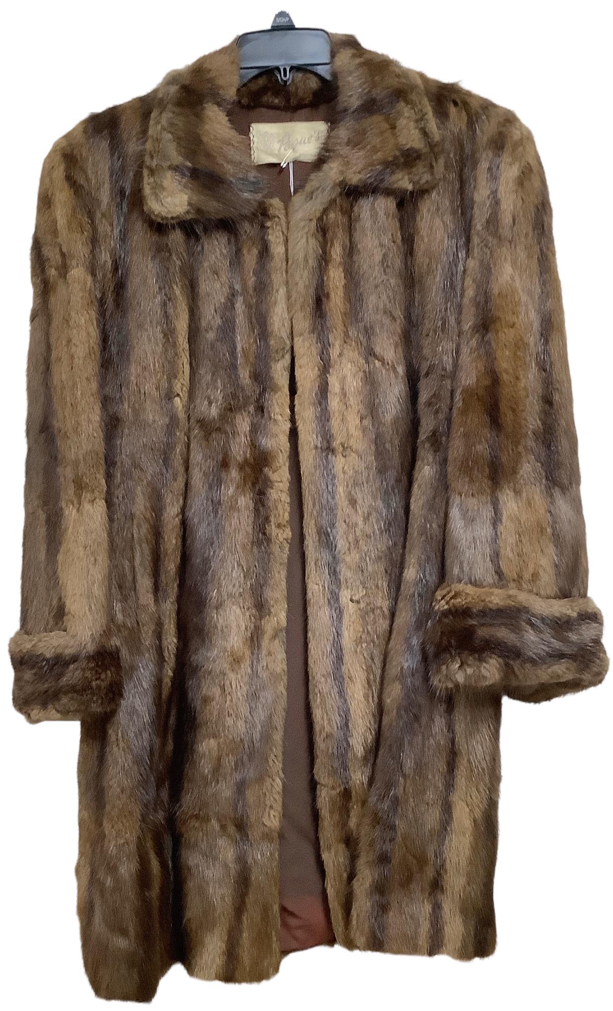 Pogue's fur jacket monogrammed "PAP" on inside. Small tear on back side of left sleeve. Possibly: Pogue's fur jacket monogrammed "PAP" on inside. Small tear on back side of left sleeve. Possibly size XL