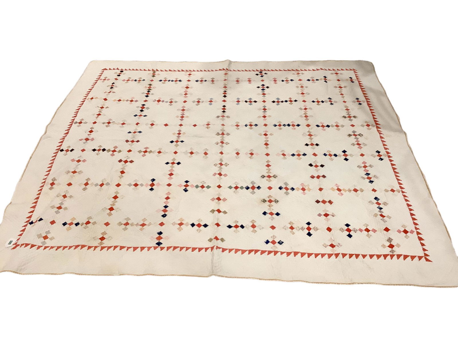 Vearly early finely quilted handmade quilt showing wear with edges unraveling, holes and stains (1 of 2)