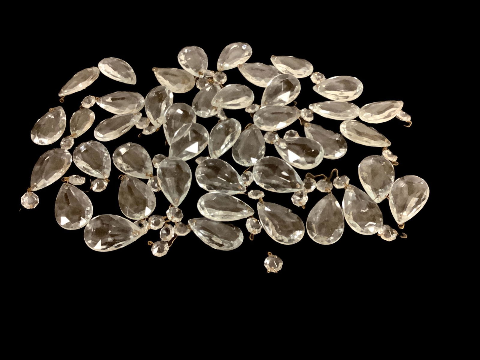 Lot of teardrop shaped lamp prisms each 2” long.: Lot of teardrop shaped lamp prisms each 2” long.