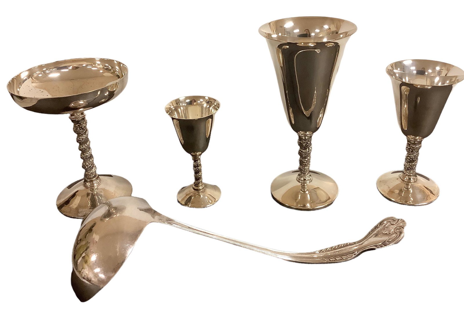 Nice large lot of silverplate stemware marked “Valero” E.P.B., Made in Spain, and a: Nice large lot of silverplate stemware marked “Valero” E.P.B., Made in Spain, and a ladle marked Poston’s Lonsdale Plate, Sheffield, England. Glasses include: - 12 cocktail - 12 cord