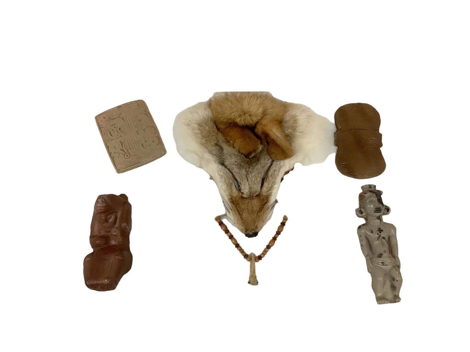 Showcase of reproduction Indian artifacts including a real animal skull pelt and flint points. No (1 of 2)