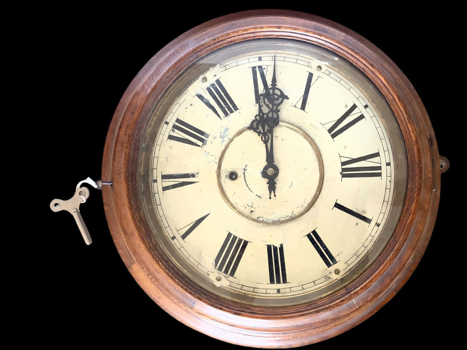 Oak case Waterbury Clock Company round gallery clock. It is marked on the edge of the face. The back (1 of 4)