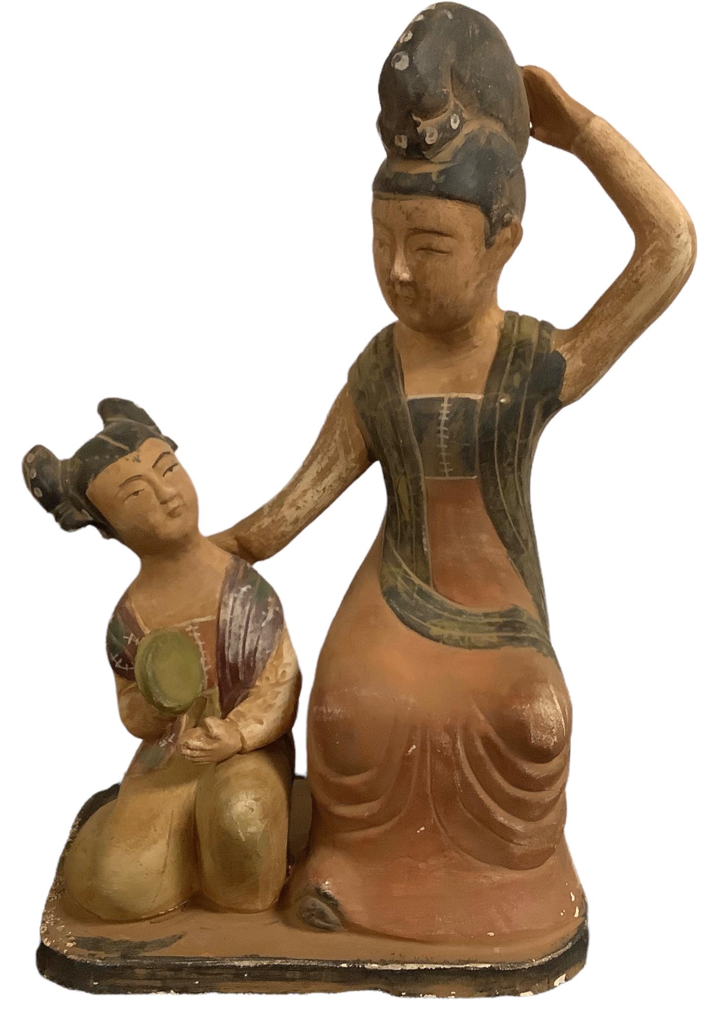 Tall clay figures standing approx 13 1/2" tall depicting Asian girl and matron in muted browns and (1 of 3)