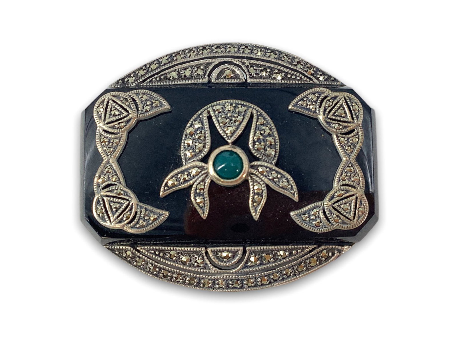 Sterling, Onyx and Marcasite Pin: Sterling, Onyx and Marcasite Pin Stamped and tested, signed, 51.0mm in length, onyx center stone on sterling mounting with sterling metal overlay and small green stone cabochon. 1.315 troy ounces tota